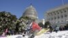 FILE - A boy crashes his sled on a hill at the U.S. Capitol after a major winter storm swept over Washington, Jan. 24, 2016.