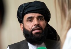 FILE - In this May 28, 2019 file photo, Suhail Shaheen, spokesman for the Taliban's political office in Doha, speaks to the media in Moscow, Russia.