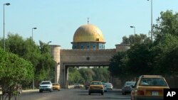 Vehicles move through the Green Zone in Baghdad, Iraq, Sept. 24, 2019. Two rockets were fired into the capital's fortified Green Zone on Monday evening, landing around one kilometer from the U.S. Embassy amid soaring tensions between the U.S. and Iran. 