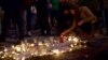 Brussels residents gather at the Place de la Bourse to light candles in memory of those killed in the terror attacks and sing songs of solidarity, March 22, 2016. (L. Bryant/VOA)