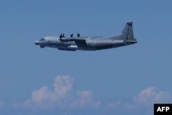 This photo taken and released on Aug. 26, 2024, by Japan's Ministry of Defense shows a Chinese military Y9 intelligence-gathering aircraft that the ministry said violated Japanese airspace.