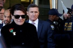 FILE - Former U.S. national security adviser Michael Flynn departs after his sentencing was delayed at U.S. District Court in Washington, Dec.18, 2018.