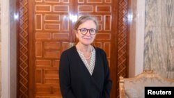 Newly appointed Prime Minister Najla Bouden Romdhane poses for a picture during her meeting with Tunisia's President Kais Saied, in Tunis, Tunisia, Sept. 29, 2021. 