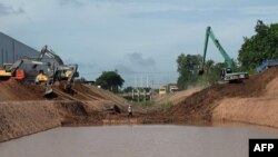 This photo taken on July 9, 2024 shows workers using excavators during the construction of the Funan Techo canal along the Prek Takeo channel in Kandal province.