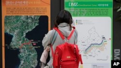 A visitor looks at a map of the Korean Peninsula at the DMZ museum inside a restricted area in Goseong, South Korea, Feb. 8, 2019.