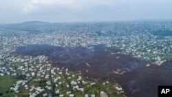 Lava from the eruption of Mount Nyiragongo cuts through Buhene north of Goma, Congo, May 24, 2021. 