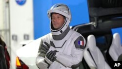 FILE - European Space Agency astronaut Thomas Pesquet of France talks to family and friends before a launch attempt at the Kennedy Space Center in Cape Canaveral, Florida, April 23, 2021.