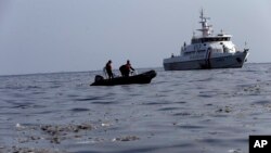 Rescuers search for victims of Lion Air passenger jet that crashed in the waters of Ujung Karawang, West Java, Indonesia, Monday, Oct. 29, 2018.