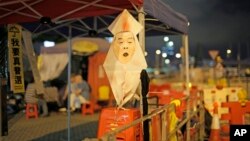 A picture of Chief Executive Leung Chun-ying is displayed outside the Legislative Council in Hong Kong, June 17, 2015. 