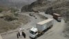Border guards check trucks en-route to neighboring Afghanistan in Pakistan's tribal area of Khyber, July 4, 2012.