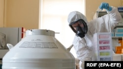 RUSSIA -- Scientist of Nikolai Gamaleya National Center of Epidemiology and Microbiology works on the production of a new two-vector COVID-19 vaccine in Moscow, Aug. 6, 2020.