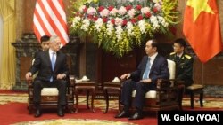 U.S. Defense Secretary Jim Mattis chats with Vietnamese President Tran Dai Quang at the presidential palace in Hanoi, Vietnam, Jan. 25, 2018.