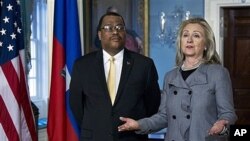 Secretary of State Clinton with Haitian Prime Minister Garry Conille in Washington, Feb. 8, 2012.