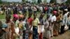 Internally displaced people wait for rations at a World Food Program distribution point near a makeshift camp set up in Bangui, Central African Republic, Dec. 13, 2013.