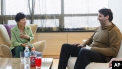 In this photo released by the South Korean presidential house, South Korean President Park Geun-hye, left, talks with U.S. Ambassador to South Korea Mark Lippert at Severance Hospital where he is hospitalized, in Seoul, South Korea, Monday, March 9, 2015.