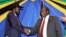 FILE - South Sudan's President Salva Kiir, left, shakes hands with rebel leader and former vice president Riek Machar after signing an agreement to reunify their political party in Arusha, Tanzania, Jan. 21, 2015.