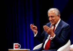 FILE - U.S. envoy for peace in Afghanistan Zalmay Khalilzad speaks during a debate at Tolo TV channel in Kabul, Afghanistan, April 28, 2019.