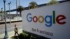 Seorang pria berjalan melewati papan iklan Google di San Francisco, 1 Mei 2019. 