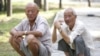 Elderly Chinese men relax in park, Beijing, China
