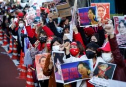 Myanmar residing in Japan protest at a rally against Myanmar's military, after it seized power from a democratically elected civilian government and arrested Aung San Suu Kyi, outside Foreign Ministry in Tokyo, Feb. 3, 2021.