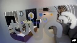 FILE - A smart home mockup is on display at the Tuya booth at CES International, Jan. 9, 2019, in Las Vegas.