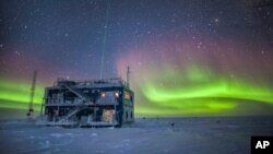 FILE - An NOAA photo shows aurora australis near the South Pole Atmospheric Research Observatory in Antarctica. When a hole in the ozone formed over Antarctica, countries around the world in 1987 agreed to phase out several ozone-depleting chemicals.