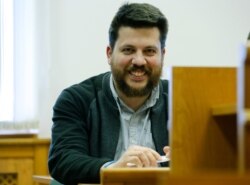 In this file photo taken on March 31, 2017, leading associate of Russian opposition leader Alexei Navalny, Leonid Volkov smiles in a court room during a hearing in Moscow.