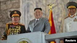 North Korean leader Kim Jong Un reacts as he attends a parade to mark the 75th anniversary of the founding of the ruling Workers' Party of Korea, in this image released by North Korea's Central News Agency on October 10, 2020.