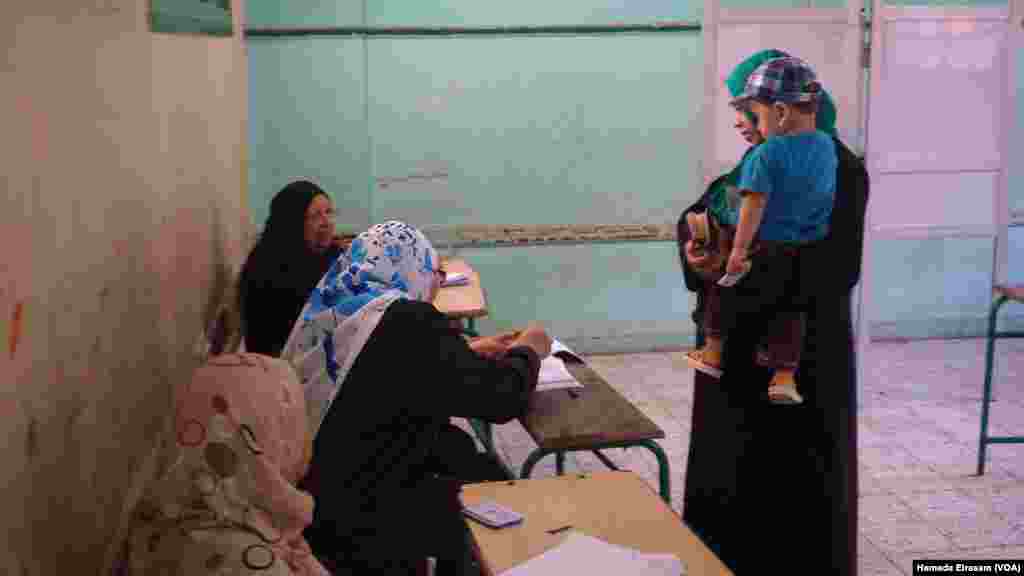 Voting in Egypt's parliamentary election will continue in phases until early December, when officials are expected to announce Egypt’s first parliament in three years. Polling station shown in Giza, Egypt, Oct. 18, 2015.