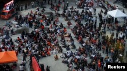 Supporters of Thailand's Move Forward Party watch a press conference in Bangkok following the Constitutional Court's verdict on Aug. 7, 2024, to dissolve the opposition group over its calls for reform. The United Nations on Aug. 8 criticized the move.
