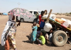 Refugees from the Tigray region of Ethiopia wait to register at the UNHCR center at Hamdayat, Sudan, Nov. 14, 2020.