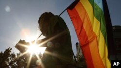 Workers carry a rope to a decommissioned ship at the Alang shipyard in the western Indian state of Gujarat.