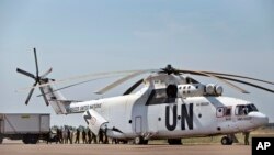FILE - A United Nations helicopter offloads supplies at the airport in Malakal, South Sudan.