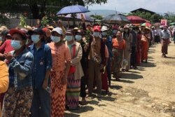 This handout from Kachinwaves taken May 5, 2021, shows people attending the funeral of Wai Phyo, also known as Thiha Thu. He was shot dead during a crackdown by security forces on demonstrations against the military coup, in Hpakant, Myanmar.