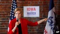 FILE - 2020 Democratic presidential candidate Sen. Elizabeth Warren speaks to local residents during an organizing event, March 1, 2019, in Dubuque, Iowa.