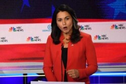 FILE - Democratic presidential hopeful U.S. Representative from Hawaii Tulsi Gabbard speaks during the first Democratic primary debate of the 2020 presidential campaign at the Adrienne Arsht Center for the Performing Arts in Miami, June 26, 2019.