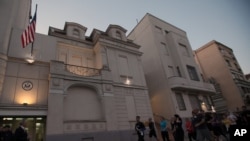 Runners arrive to the U.S. embassy in an organized memorial run to show solidarity with victims of the Boston Marathon bombing, April 16, 2013, in Belgrade, Serbia. 