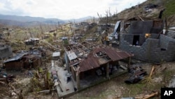 Homes destroyed by Hurricane Matthew stand in Moron, Haiti, Oct. 10, 2016.