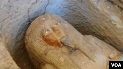 A worker wearing a face mask rescues a child at the site where a hotel being used for the coronavirus quarantine collapsed, in the southeast Chinese port city of Quanzhou, Fujian province.