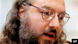 FILE - Jonathan Pollard speaks during an interview in a conference room at the Federal Correction Institution in Butner, North Carolina, May 15, 1998.