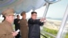 FILE - North Korean leader Kim Jong Un inspects the construction site of the Wonsan-Kalma tourist area as Kim Su Gil, third from left, new director of the General Political Bureau of the Korean People's Army, looks on, in this undated photo.