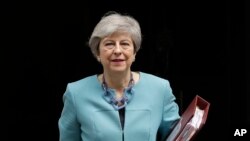 British Prime Minister Theresa May leaves 10 Downing Street in London, to attend Prime Minister's Questions at the Houses of Parliament, Wednesday, June 19, 2019. Britain's Conservative Party are set to kick one more candidate out of the contest to…