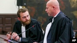 Lawyer for the accused, Sven Mary, right, attends the trial of Salah Abdeslam and Sofiane Ayari, at the Brussels justice palace in Brussels, April 23, 2018. 