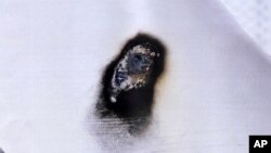 In this March 20, 2017 photo released by Mahaska County Sheriff's Office, burned damage on the pipeline at an above-ground safety valve site southeast of Des Moines near Oskaloosa, Iowa is seen. Authorities in South Dakota and Iowa on Tuesday confirmed incidents of vandalism against the Dakota Access oil pipeline in which someone burned a hole through an empty section of pipe. 