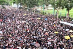 Tens of thousands of people marched in Hong Kong, June 15, 2019, to demand the scrapping of a proposed extradition law.