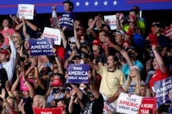 Supporters cheer as President Donald Trump speaks during a campaign rally at Smith Reynolds Airport, Sept. 8, 2020, in Winston-Salem, N.C.