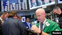 Traders work on the floor of the New York Stock Exchange (NYSE) in New York City, U.S., July 28, 2016.