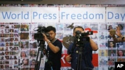 FILE PHOTO - Thai video journalists working at Thai Journalists Association during the International World Press Freedom Day before a press conference in Bangkok, Thailand, Wednesday, May 3, 2017. Thai media organizations have called on the government to withdraw a bill that would set up an appointed council to regulate print and online media, which along with journalists and contributors would be required to be licensed. (AP Photo/Sakchai Lalit)