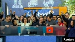 Facebook Founder and CEO Mark Zuckerberg rings the NASDAQ Stock Market Opening Bell remotely from "Facebook" headquarters in Menlo Park, California, May 18, 2012.