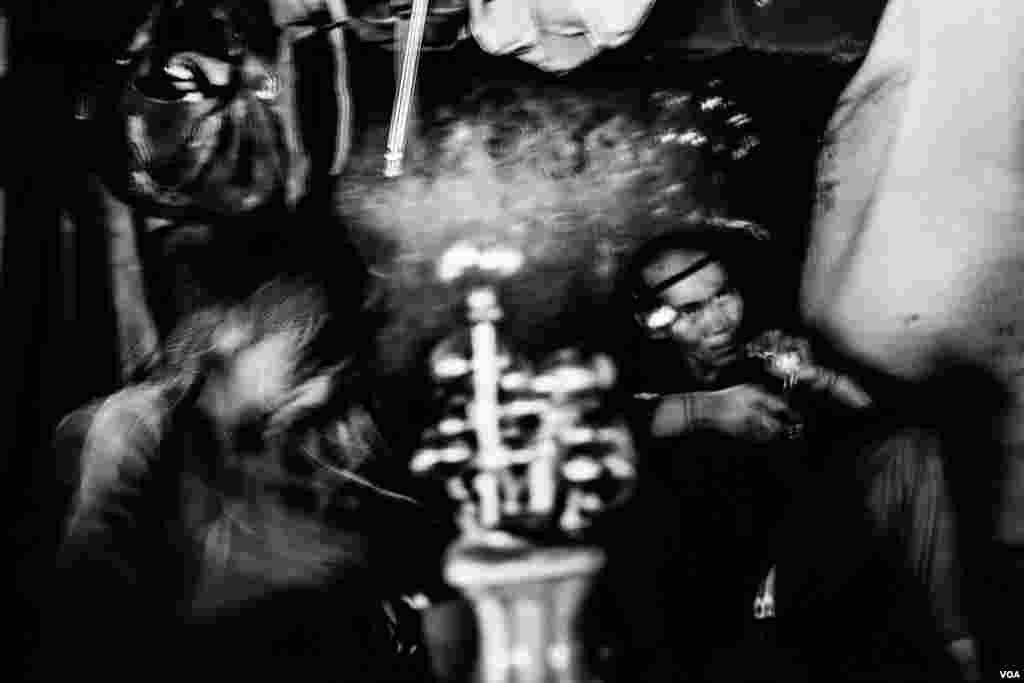 Each day under the bridge in Pul e Sukhta dozens of men gather to take drugs. Many of them are homeless. (Maciej Stanik/VOA)